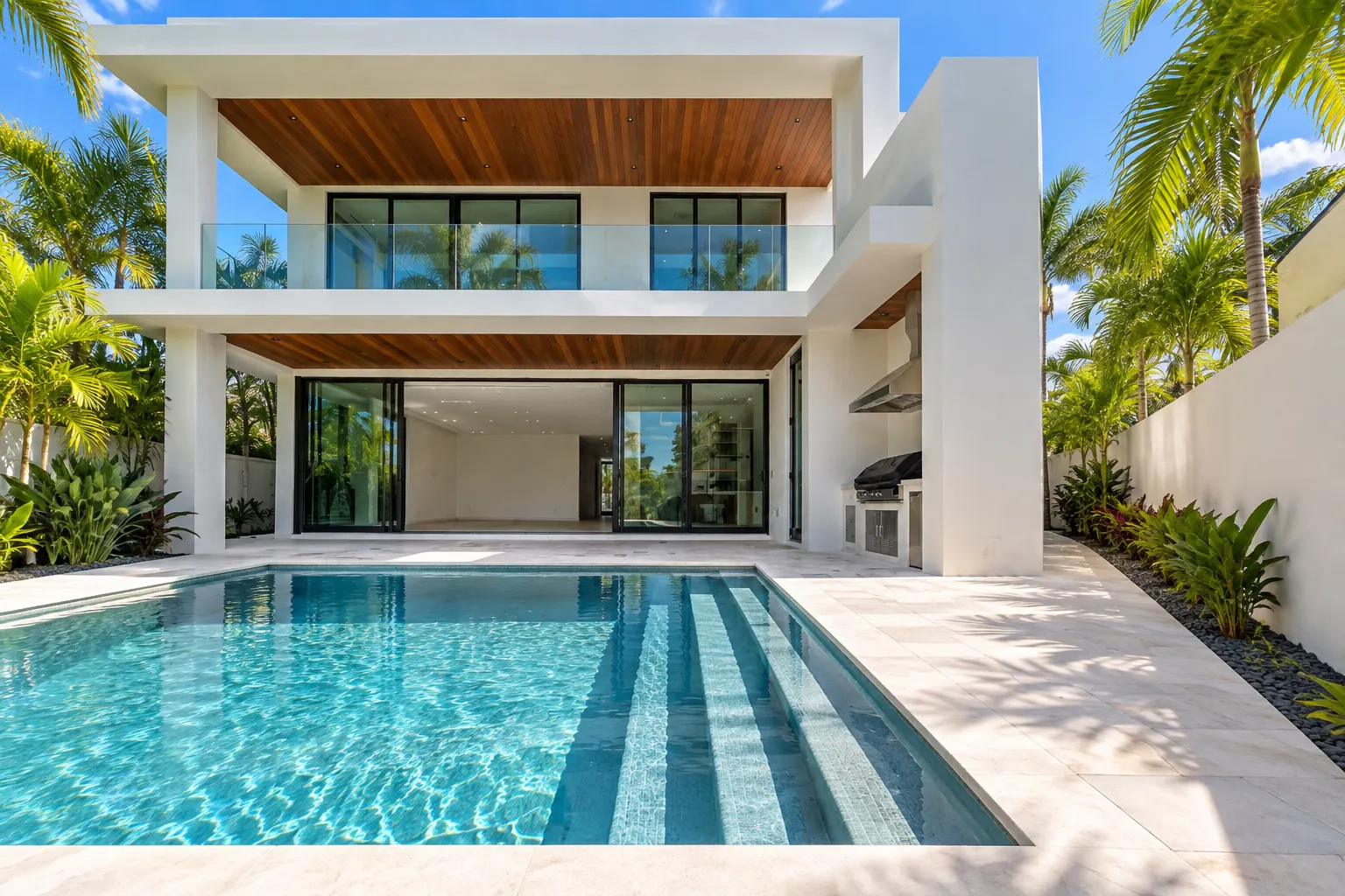 New rectangular pool in a narrow Doral backyard