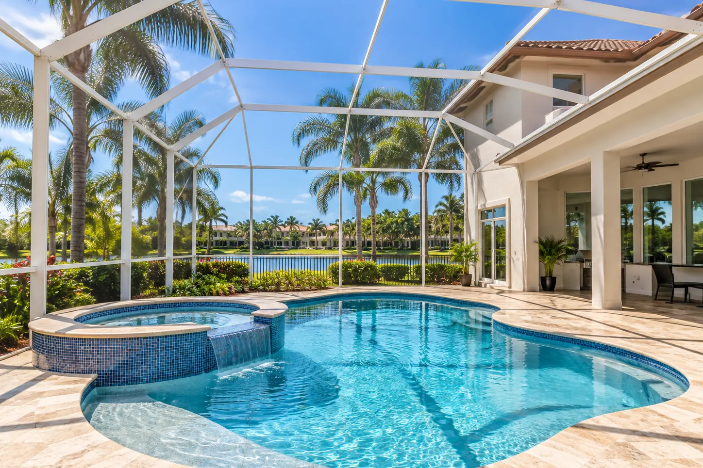 New freeform pool and spa at a lakefront Weston home